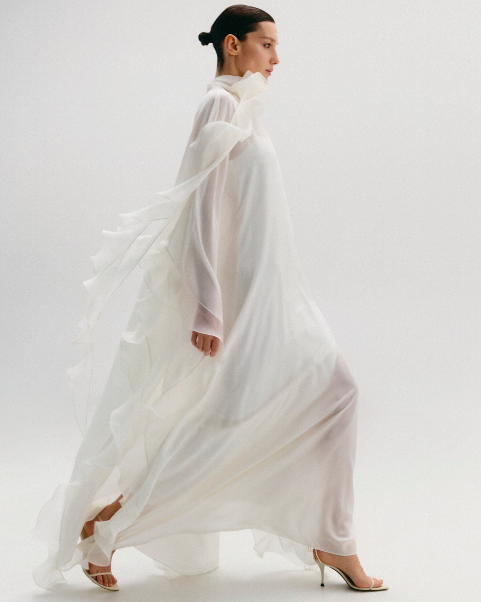 High-Neck Cape Dress Adorned With Cascading Decorative Accents