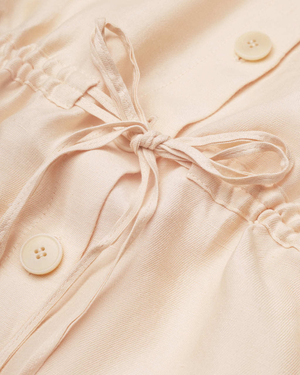 Drawstring-waist floral-appliqué blouse in light apricot