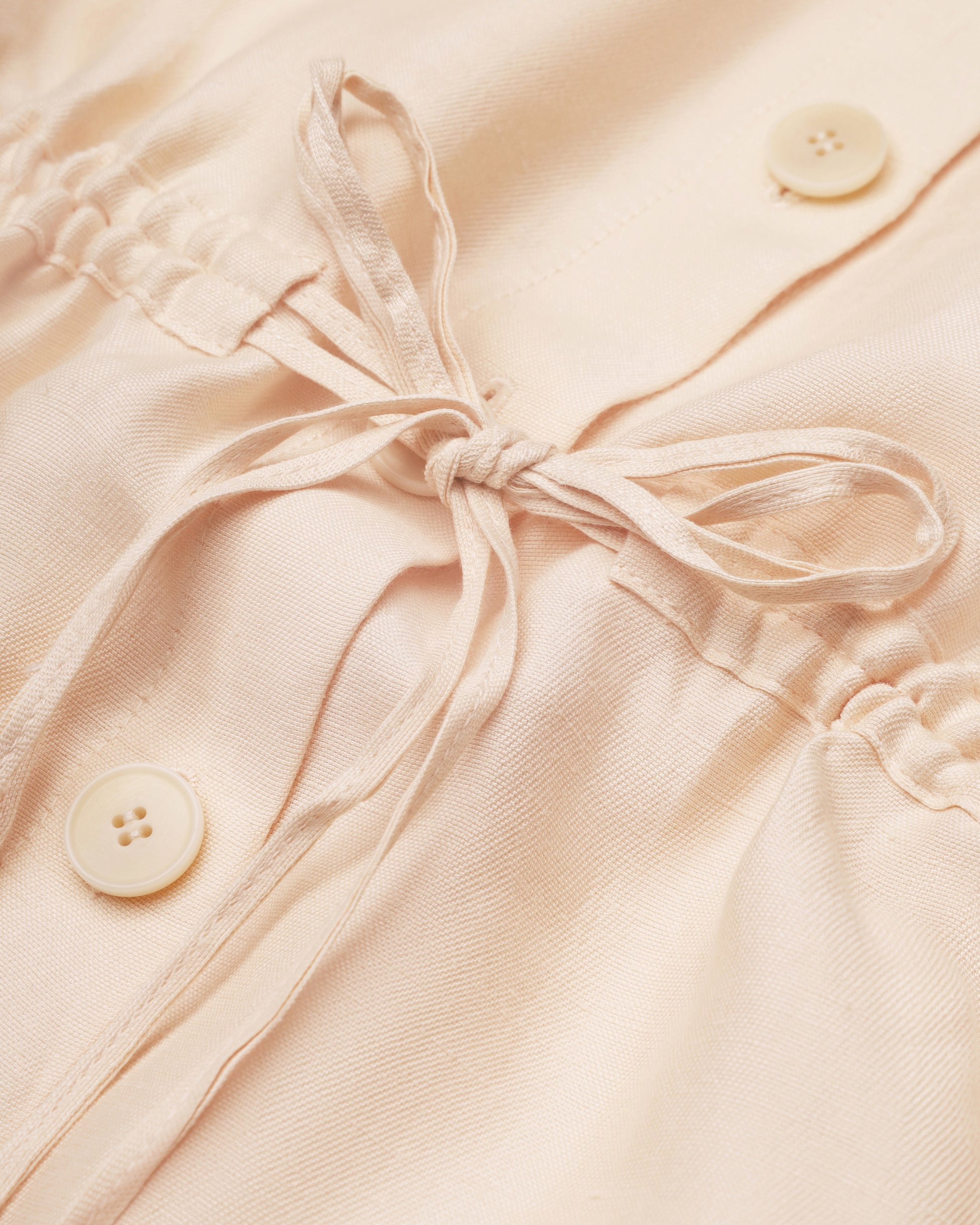 Drawstring-waist floral-appliqué blouse in light apricot