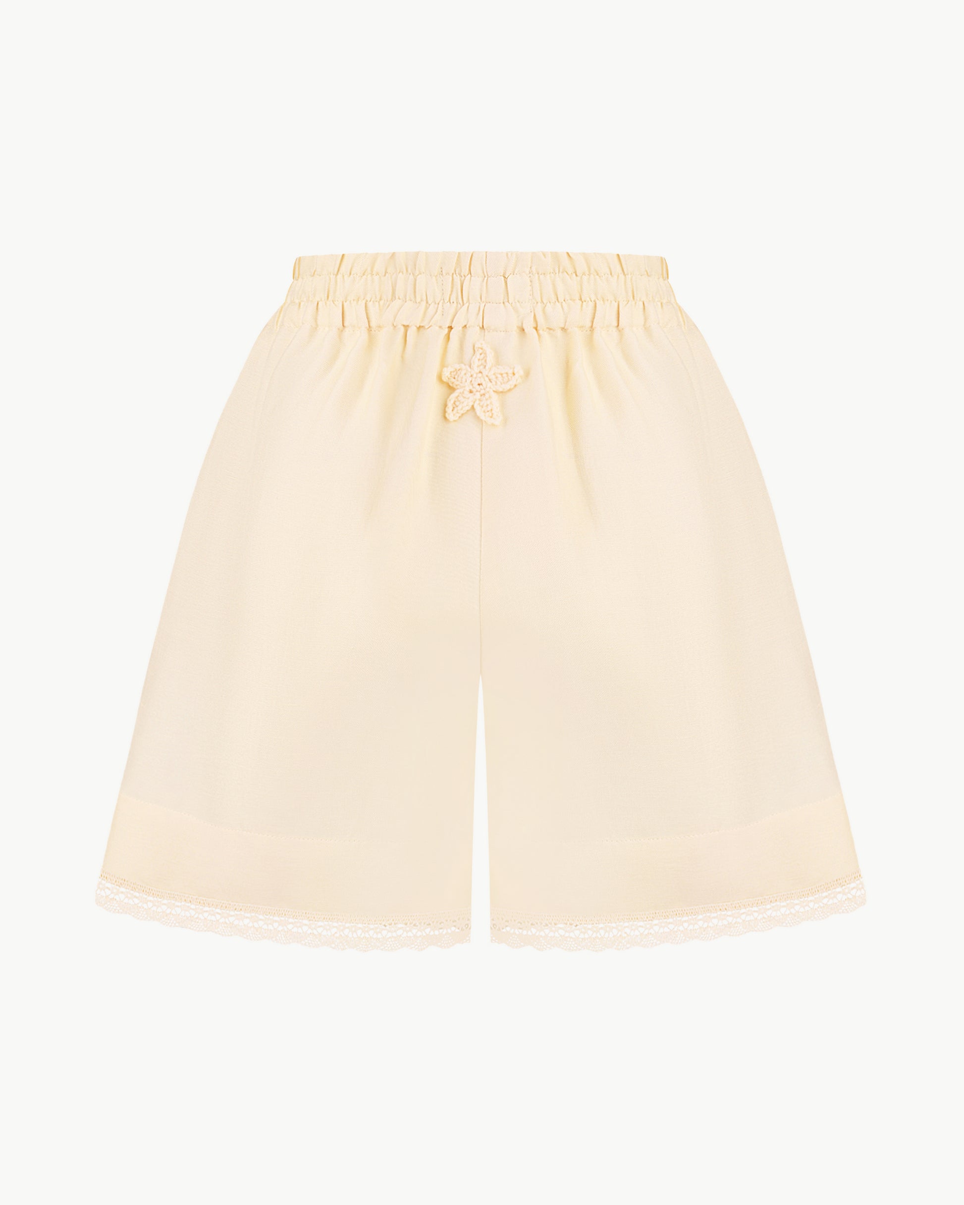 Lace-trimmed high-waisted shorts in light apricot