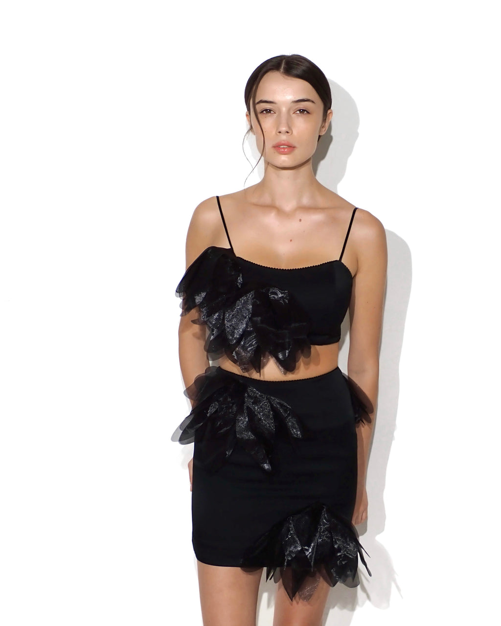 Spaghetti-strap floral-appliqué cropped top in black