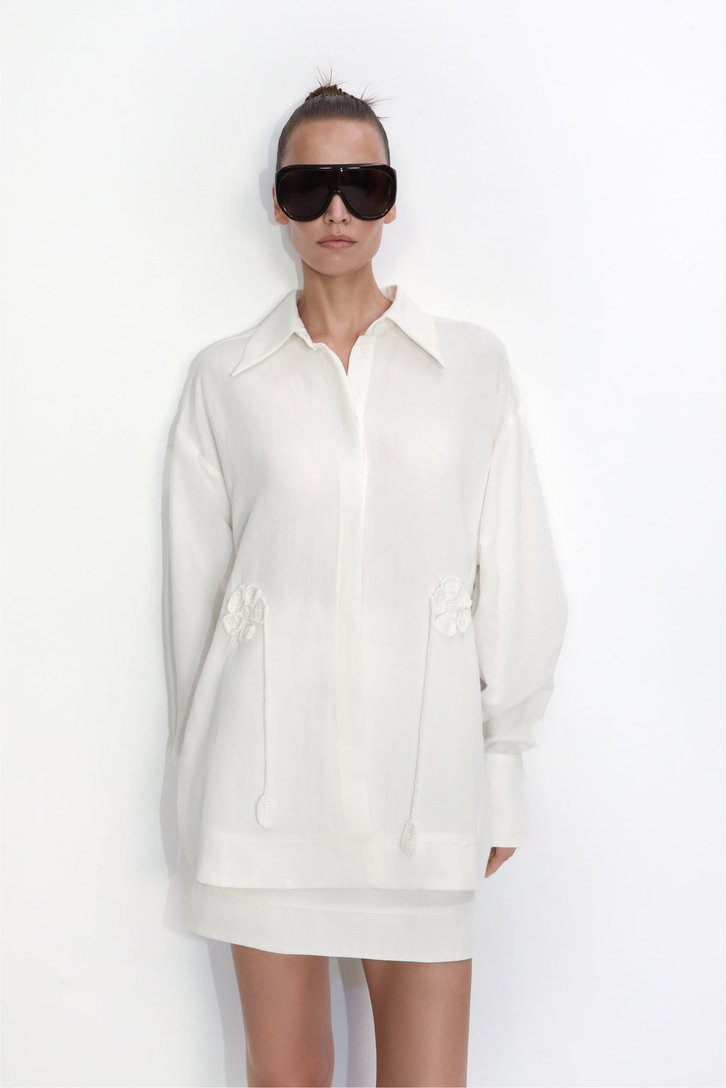 Relaxed-fit blouse with hand-crocheted floral details