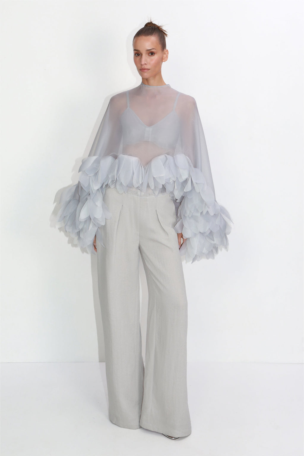 Structured bustier with sheer cape and floral petals