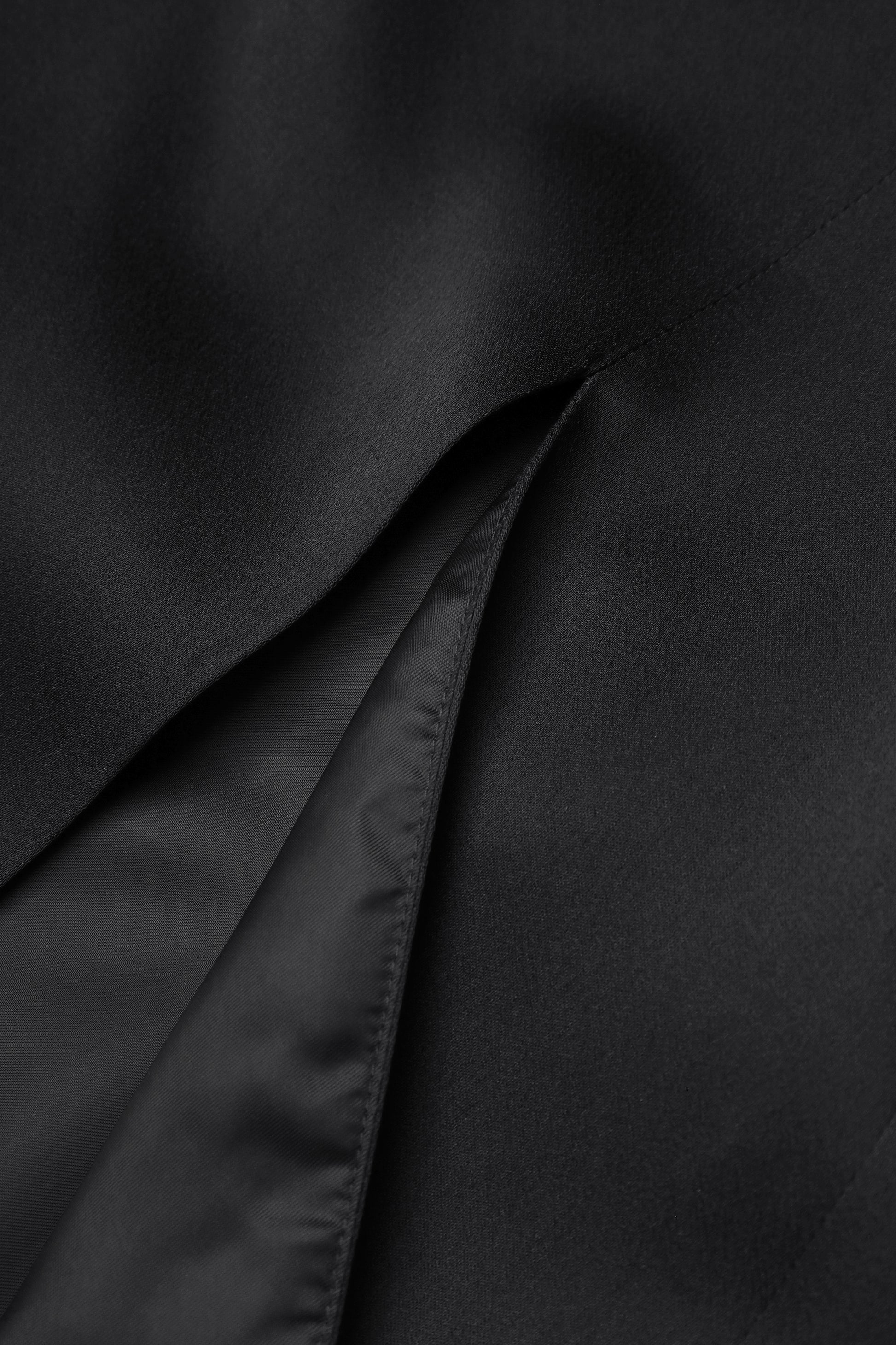 Slip dress with floral ruffle cape in black