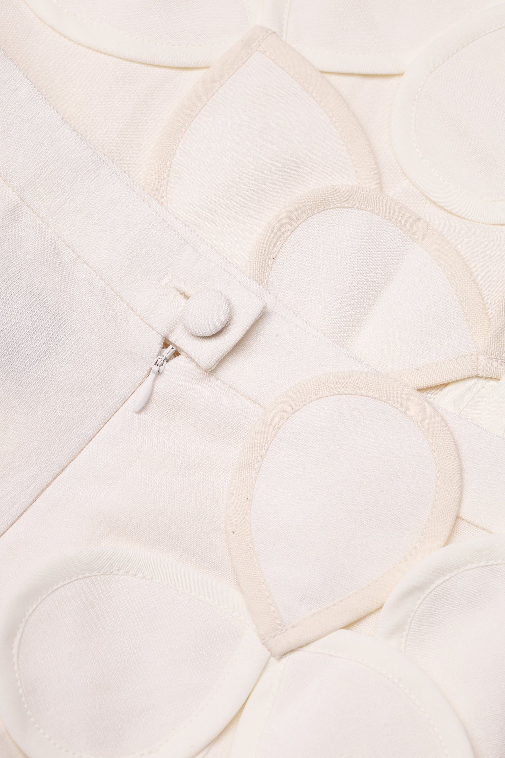 Sculptural petal-appliqué midi skirt in ivory