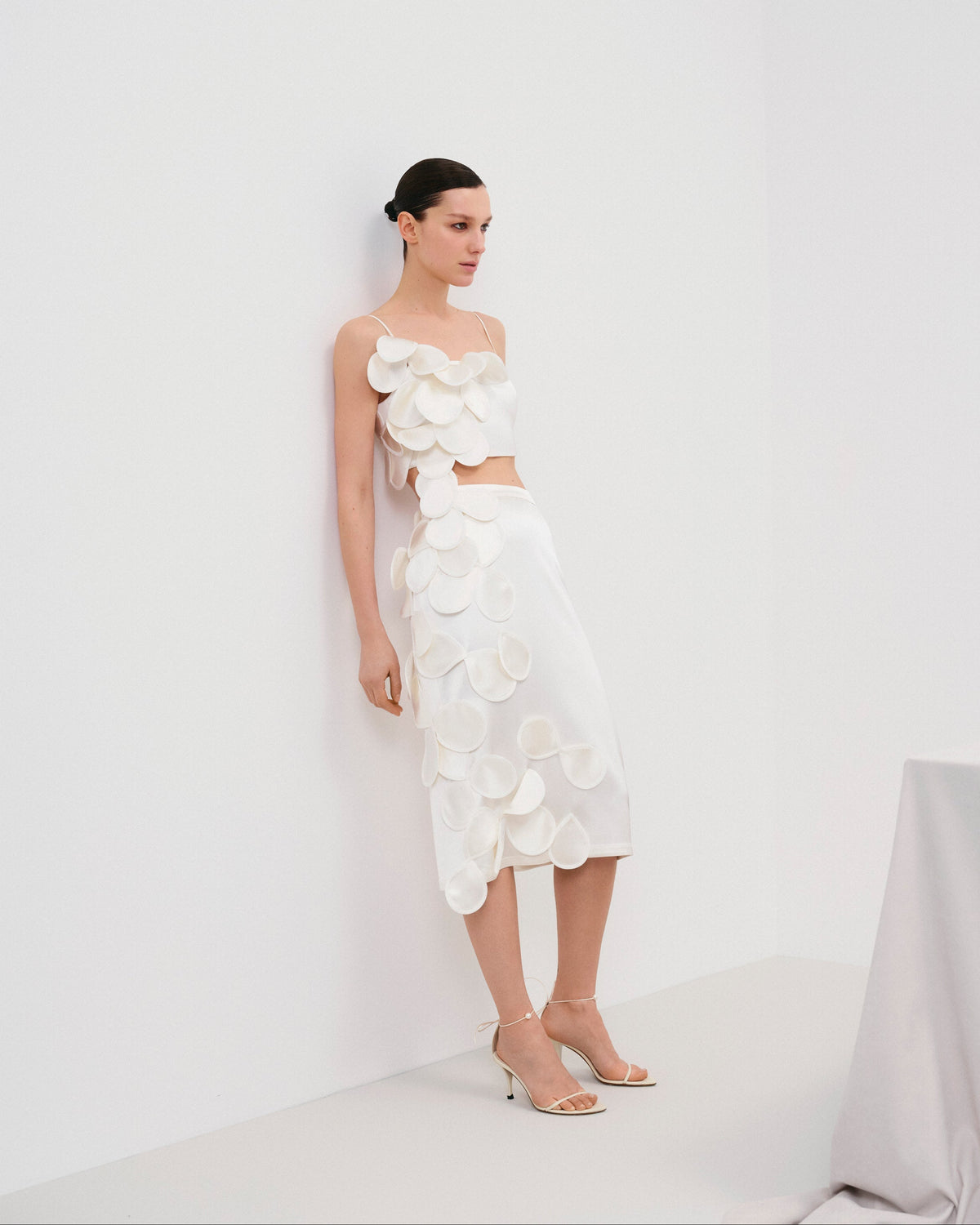 Below-knee bridal skirt featuring decorative floral appliqués (handcrafted decor).