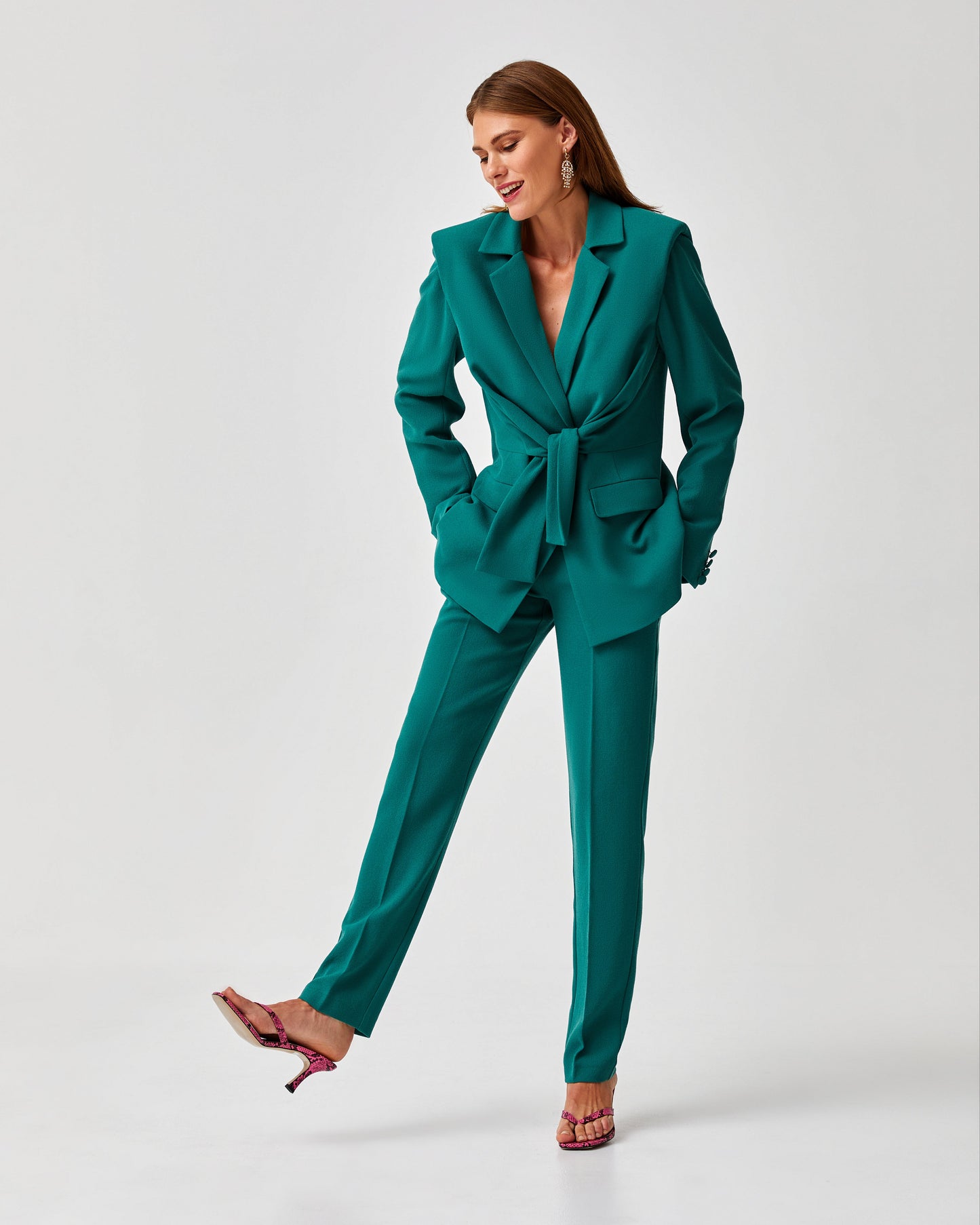 Long straight high waist trousers with side pockets, front zipper button.