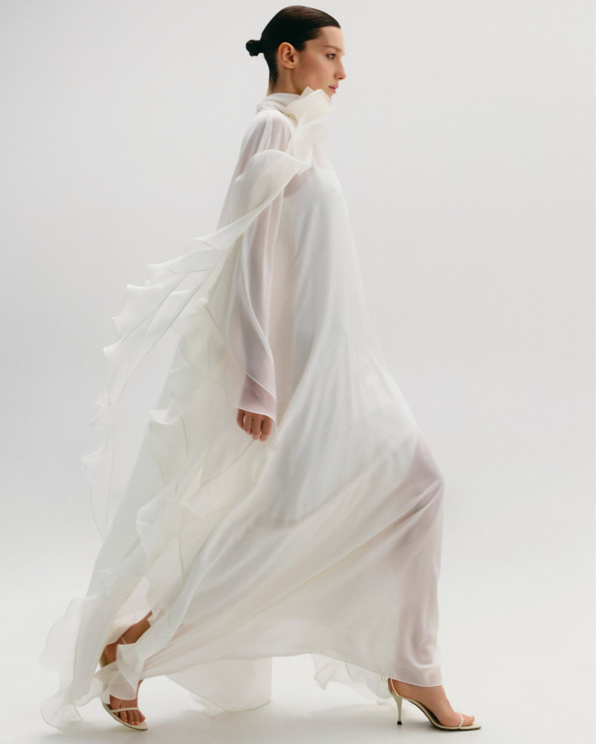 High-Neck Cape Dress Adorned With Cascading Decorative Accents