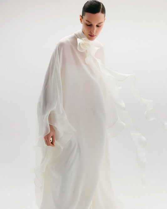 High-Neck Cape Dress Adorned With Cascading Decorative Accents